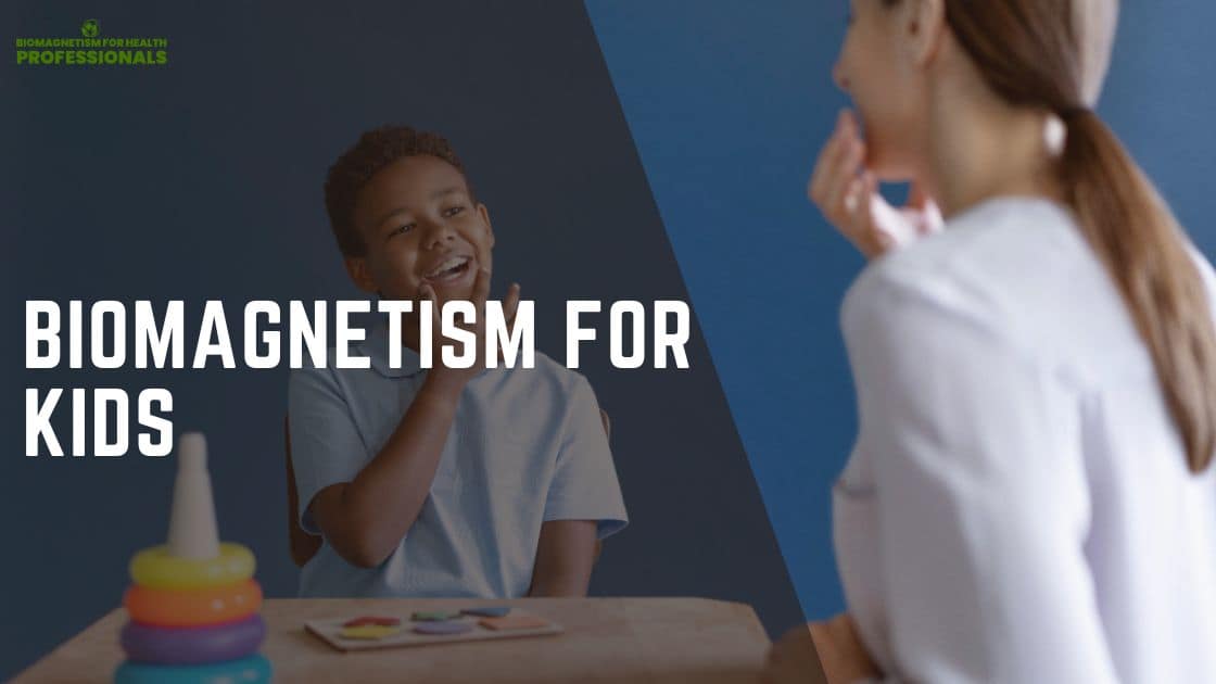 A child sits at a table with colorful toys, including a stack of rings and some colored shapes, while an adult engages with the child in a room with a blue background. The text on the image reads Biomagnetism for Kids