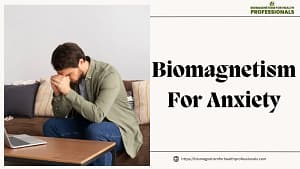 Person in distress sitting on a couch with a laptop on a table, promoting Biomagnetism for Anxiety treatment