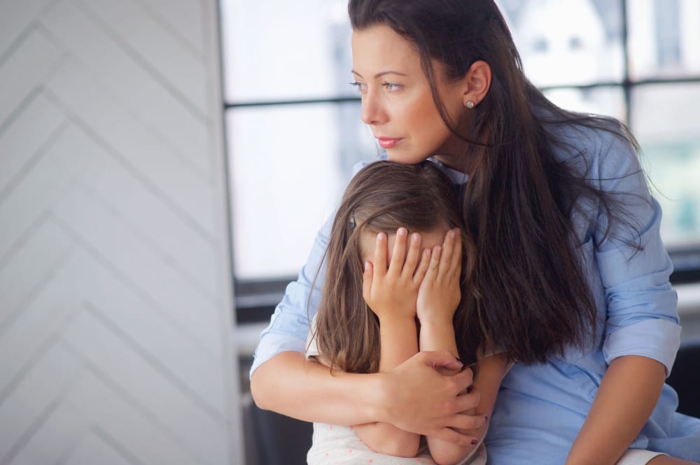 mother sitting with her daughter