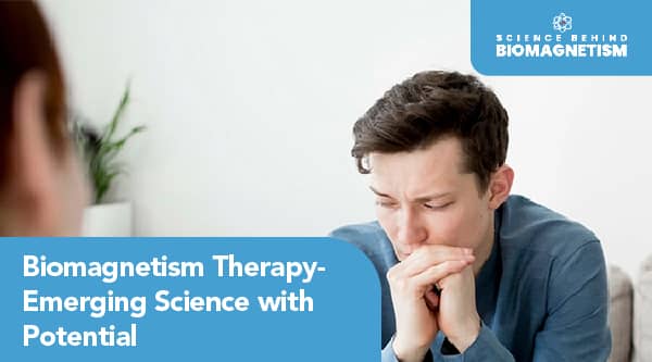 A therapist sitting across from a patient, both engaged in conversation during a Biomagnetism therapy session