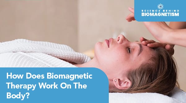 A person lying down receiving biomagnetism therapy with another person’s hands and text written "How Does Biomagnetic Therapy Work On The Body"