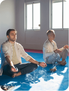 two-concentrated-men-meditating-together-focused-middle-adult-men-sitting-lotus-pose-with-closed-eyes-hobby-spirituality-health-concept